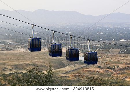 Four Hanging Cabins Of The Ropeway To The Savitri Mata Temple On The Hill Near Pushkar City, Rajasth
