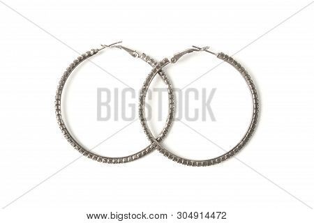 Female Metal Earrings In The Form Of Rings Isolated On White Background