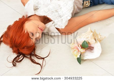 Portrait Of Beautiful Redhead Mature Woman Posing