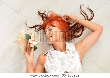 Portrait Of Beautiful Redhead Mature Woman Posing
