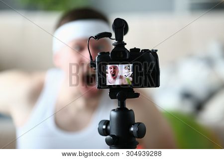 Professional Digital Camera Record Screaming Man. Sport Blogger Shooting Fitness Video On Camcorder 