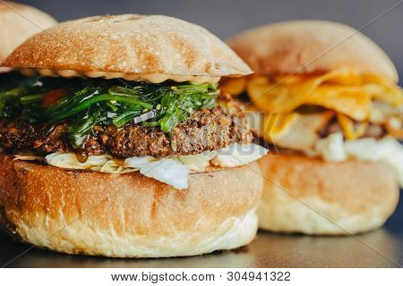 Burger Flyer. Cheese Burger With Grilled Meat, Cheese, Salad And Onion Rings. Close-up Of Delicious 