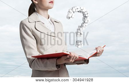 Attractive Woman Holding Open Notebook With Question Mark From Cubes. Business Consultation And Lega