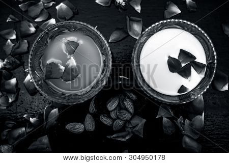 Milk And Almond Face Pack On Black Colored Shiny Surface I.e. Raw Milk,almond,honey Well Mixed In A