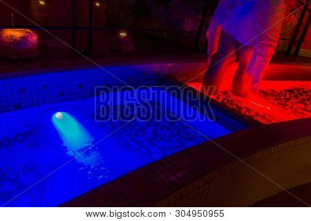 Woman Stand In Kneipp Walk On Red Warm Water, Wellness