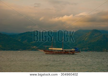 Angra Dos Reis, Brazil, Ilha Grande: Beautiful Scenery With Ships Overlooking The Sea And Mountains