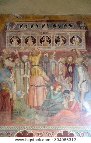 FLORENCE, ITALY - JANUARY 10, 2019: The crowd witnessing the preaching, detail from St Peter of Verona preaching, Spanish Chapel in Santa Maria Novella Principal Dominican church in Florence, Italy