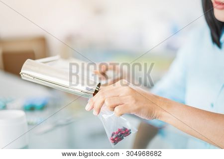 Pharmacists Are Checking At Drug Store Blurred