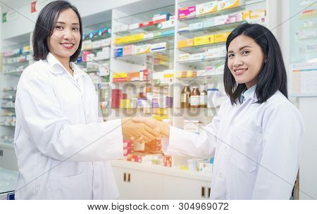 Drug Store Of Pharmacist Shaking Hands With A Client At The Pharmacy , Health Concept