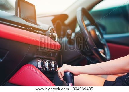 Woman Driving, Using A Manual Transmission Stick Shift. Close Up Of Woman Shifting Gears On Gearbox 