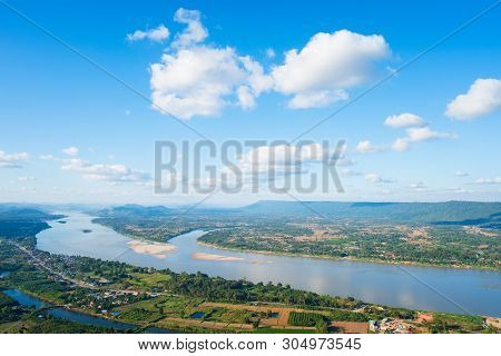Beautiful View From Mountain Green Valley Stream Landscape To Mekhong River And Clouds On The Blue S