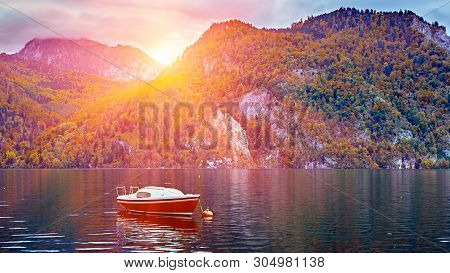 Beautiful Scenic Sunset Over Austrian Alps Lake. Boats, Yachts In The Sunlight Infront Of Church On 