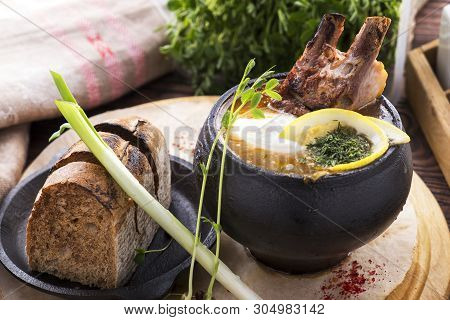 Russian Meat Solyanka Soup In A Pot. Solyanka Soup With Pork Ribs.