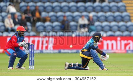 CARDIFF, WALES. 04 JUNE 2019: wicketkeeper Mohammad Shahzad of Afghanistan takes a catch to dismiss Kusal Perera of Sri Lanka during the Afghanistan v Sri Lanka, ICC Cricket World Cup match