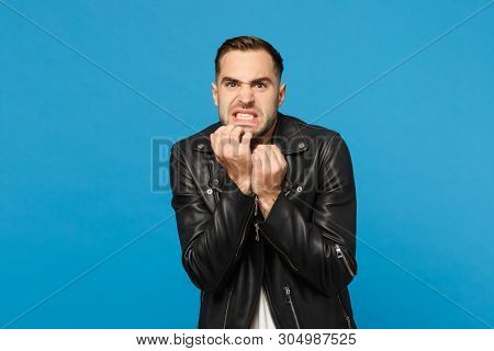 Young Sad Frustrated Worried Unshaven Man In Black Jacket White T-shirt Looking Camera Isolated On B