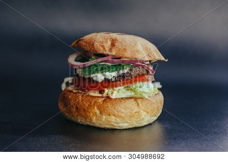 Burger Flyer. Cheese Burger With Grilled Meat, Cheese, Salad And Onion Rings. Close-up Of Delicious 