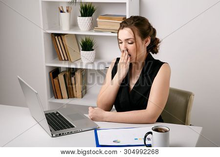 Tired Femle Worker Feeling Asleep. Yawning Woman In Office.