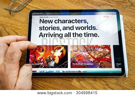 Paris, France - Mar 27, 2019: Pov Personal Perspective On Apple Arcade Webpage Seen On Modern Ipad P