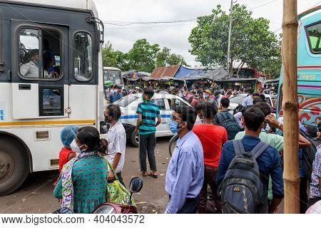 People Gathered In The Bus Stand Waiting For The Bus With Masks During Unlock Period In Kolkata, Wes