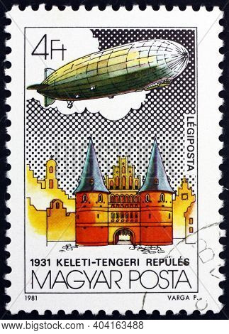 Hungary - Circa 1981: A Stamp Printed In Hungary Shows Graf Zeppelin Over Holsten Tor, Lubeck, Balti