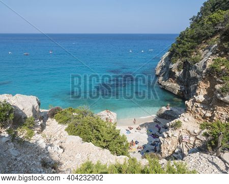 Gulf Of Orosei, Sardinia, Italy, September 8, 2020: A View Of Cala Goloritze Beach With Bathing Tour