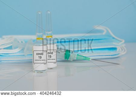 Vaccine, Maskas And Syringe, Prevention, Immunization And Treatment From Coronavirus Covid 19 Infect