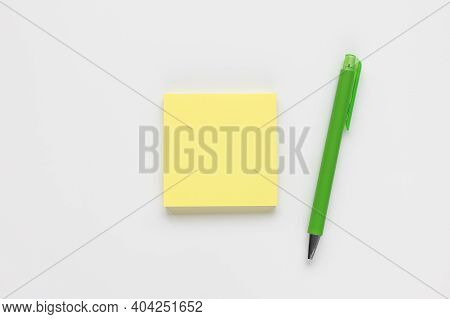 Self-stick Yellow Note Pad Or Sticky Note And Pen On White Background. Study Notes Concept, Copy Spa