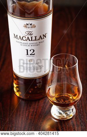 Trondheim, Norway - Mai 19 2020: Macallan single malt scotch whisky 12 years bottle and glass