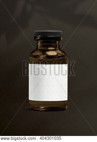 Vitamin injection amber glass bottle with luxurious white label for health and wellness product packaging