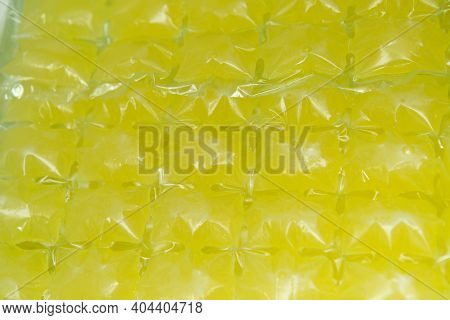 Lemon Background. Freshly Squeezed Lemon Juice Is Prepared For Freezing In Ice Bags.