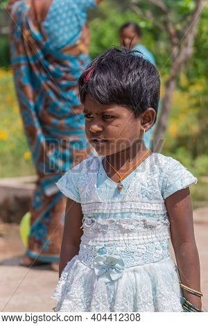 Lakundi, Karnataka, India - November 6, 2013: Closeup Of Little Girl In White-blue Dress, Short Blac