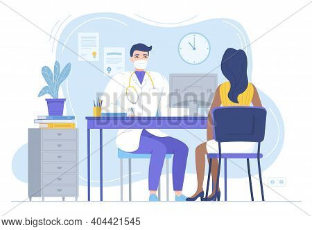 Doctor In Mask Consulting Female Patient. Physycian Sitting At The Desk With Monitor. Family Therapi