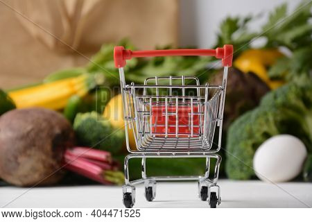 Shopping Trolley Cart And Different Groceries .healthy Food Background. Healthy Balanced Food Vegeta