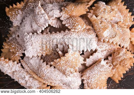 Italian Carnival And Typical Food. Sfrappole Or Chiachiere Or Angel Wings And Aromatic Coffee On A W
