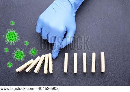 Doctor Stopping Domino Effect On Grey Background, Top View. Prevent Spreading Of Coronavirus