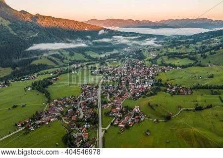 Aerial View Of German Village Bad Oberdorf At Sunrise Near Zugspitze And Austria Border