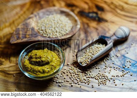 Mustard Seeds Granum Sinapis And A Wooden Spoon