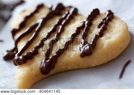 Pouring Chocolate On Just Baked Christmas Cookies