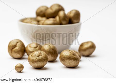 White Ceramic Bowl Full Of Chocolate Pralines. Sweet Truffles With Cinamon, Cardamom And Clove On A 