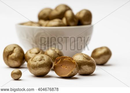 White Ceramic Bowl Full Of Chocolate Pralines. Sweet Truffles With Cinamon, Cardamom And Clove On A 
