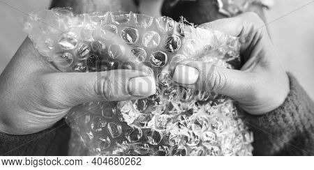 Woman Hands Popping Bubbles In Bubble Wrap. Anti Stress, Relax Concept