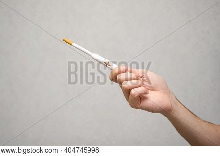Man Combined A Classic Nicotine Cigarette And Hybrid Electronic Smokeless Cigarette Device, Rules Fo