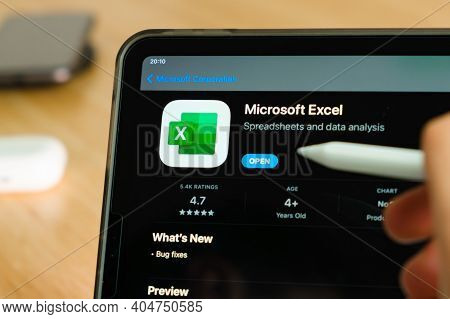 Microsoft Excel Logo Shown By Apple Pencil On The Ipad Pro Tablet Screen. Man Using Application On T