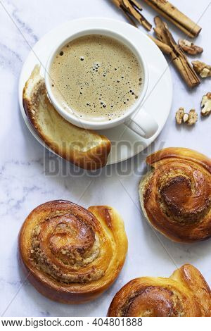 Cinnamon Rolls With Nut Filling, Served With Coffee.