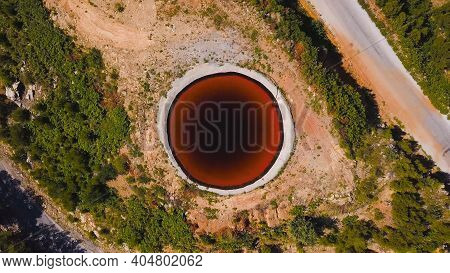 Top View Of Sinkhole. Clip. Incredible Natural Phenomenon In Form Of Sinkhole With Brown Water In Fi