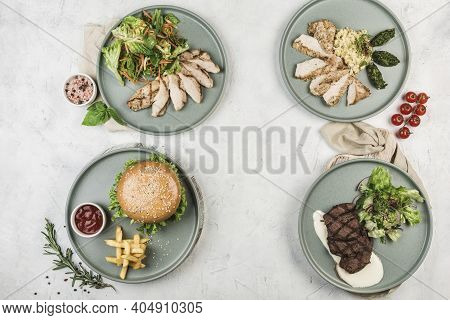 Several Warm Dishes With Chicken, Turkey, Beef Fillets And Pork Cutlet Burgers In Different Plates S