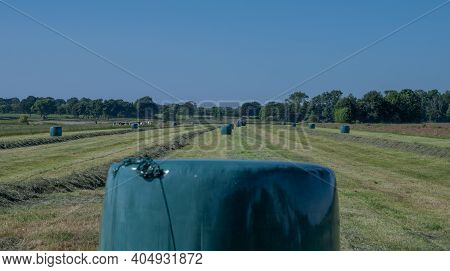 Hamburg, Germany - June 24, 2021: Black Case Tractor With A Red Kuhn Meifort Straw Fixed Chamber Pre
