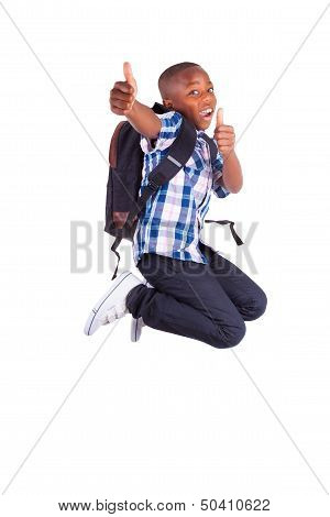 African American School Boy Jumping And Making Thumbs Up - Black People