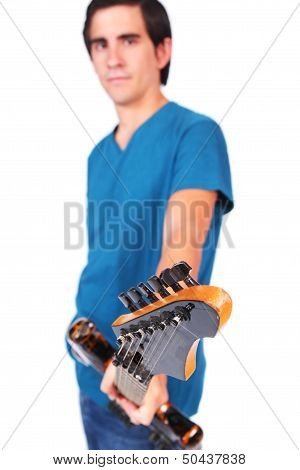 A Male Guitarrist In Action