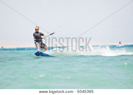 Kiteboarder surf
